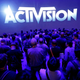 people standing under an Activision Blizzard sign